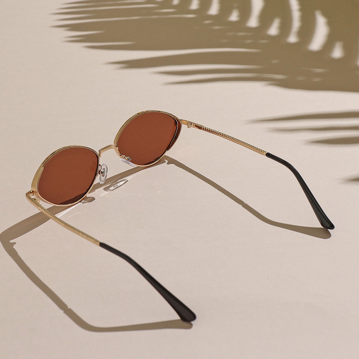 Reclaimed Vintage 90s oval sunglasses in brown | ASOS